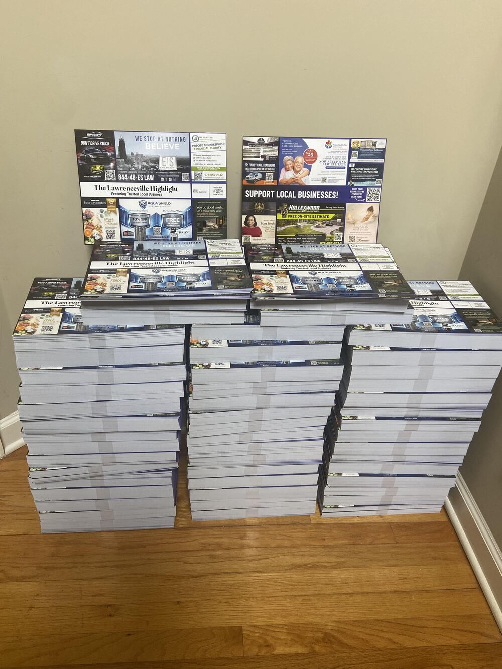 Stacks of Edition No. 1 postcards stacked and ready to mail